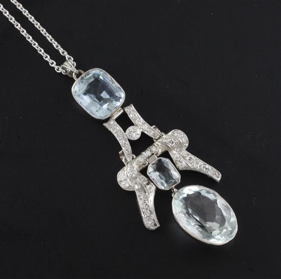 A platinum, aquamarine and diamond set double drop pendant, pendant 2.25in.